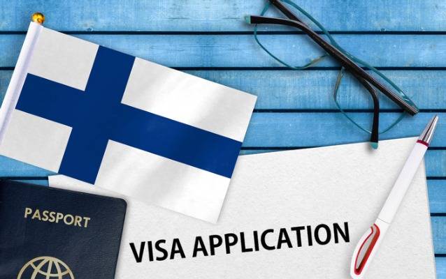 Анкета на визу, флаг Финляндии и паспорт